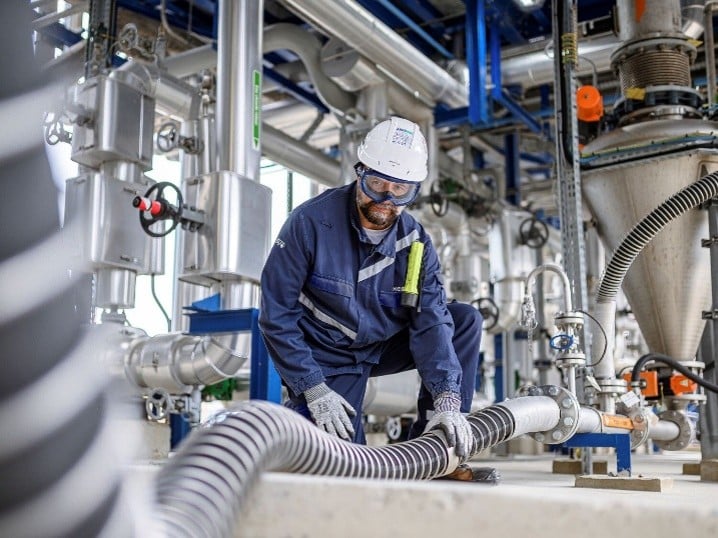 technician-inspecting-hose